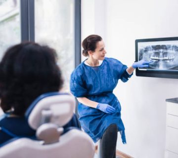 dentist explaining tooth x rays to a patient 4