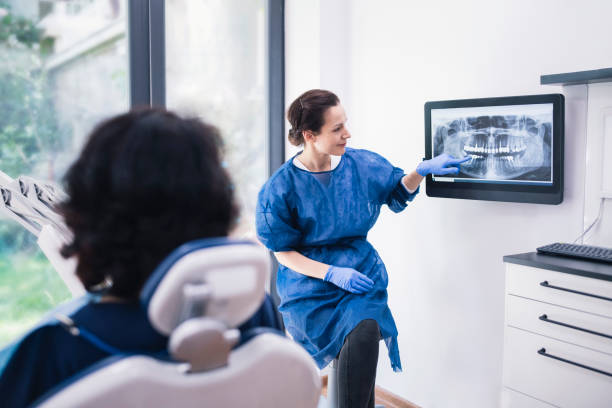 dentist explaining tooth x rays to a patient 4