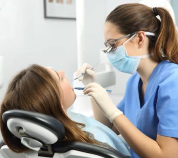 dentist examining a patient teeth 1