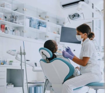 dentist examining patient in modern dental clinic 1