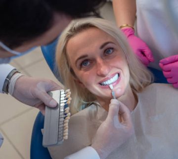 dentist using a palette tooth color sample 5