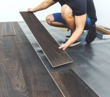 laminate flooring worker installing new floor