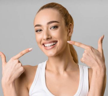 orthodontic concept happy girl showing her beaming white teeth