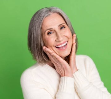 photo of gorgeous lady pensioner middle age hands touch cheeks laughing enjoy her new face 1