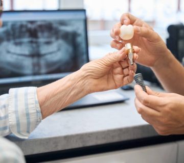 prosthetist consults an elderly lady in a dental clinic 1