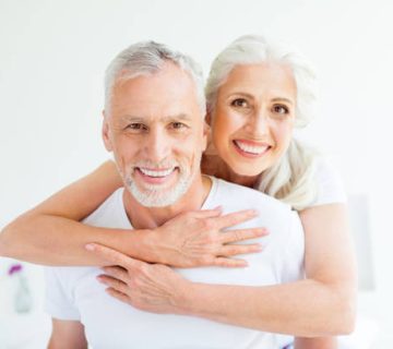 two carefree careless people with in pajama sleep wear sleepwear nightwear grey hair cuddle