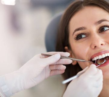 woman having teeth examined at dentists 3