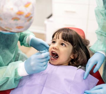 young girl in dental clinic